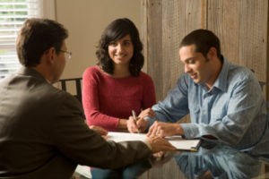 Couple Signing a Contract