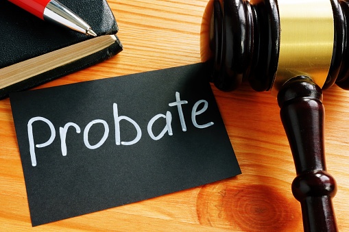 Probate services concept: piece of paper with the word Probate on it and a gavel on a desk