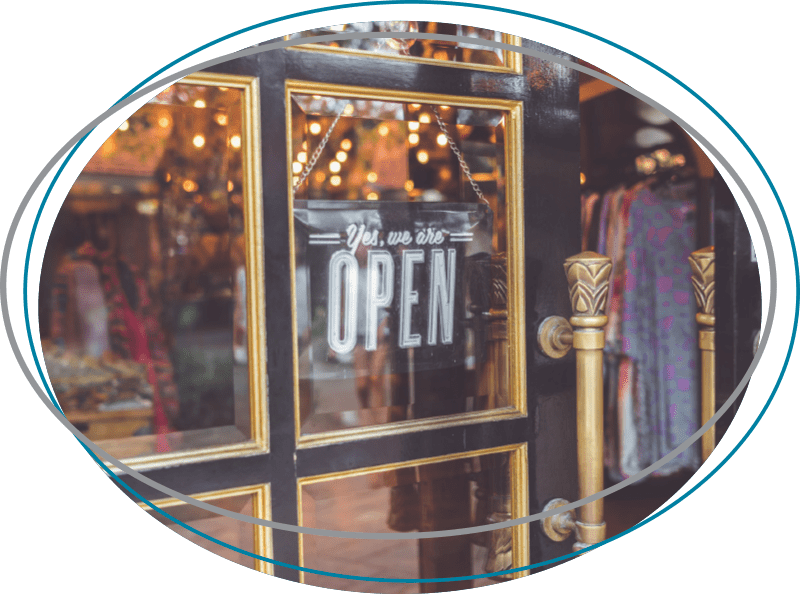 Closeup photo of black door with yes, we are open sign