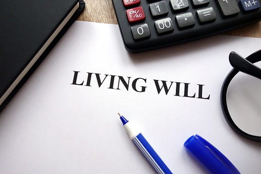 paper with living will typed on it. A living will is an important part of an estate plan