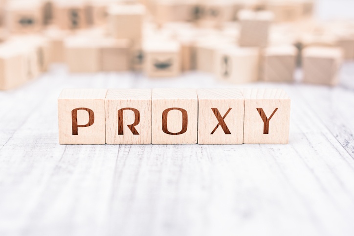 Health care proxy concept: The Word Proxy Formed By Wooden Blocks On A White Table
