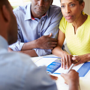 Mature Black Couple Meeting With Financial Advisor At Home