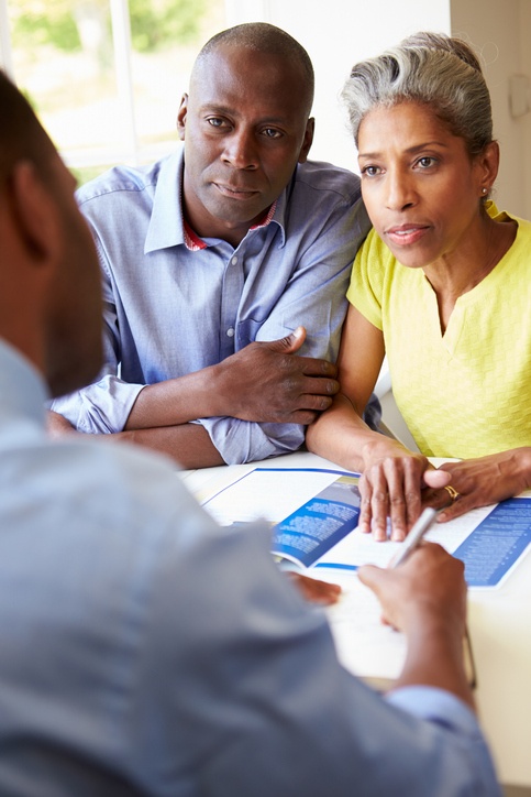 Mature Black Couple Meeting With Estate Planning attorney to create a will