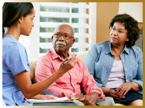 Over 65 year old man and his daughter meeting with a nurse